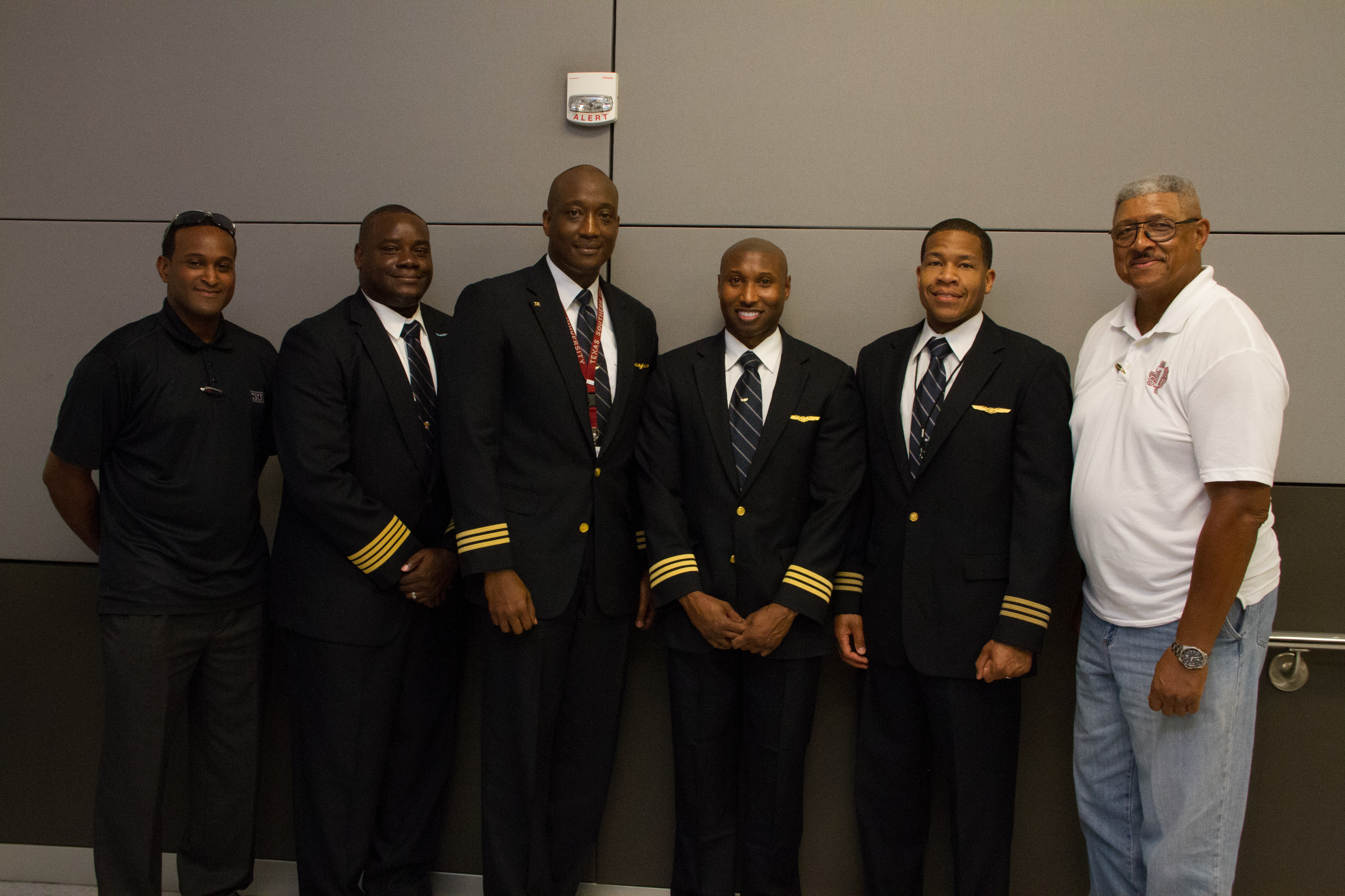Captain Edwards stands proud with former students he trained; most who attended Sterling High School and who now work at major airlines like United. Pilot pictured her from left to right: Matthew Julien, Pascal Alexander, Donald Turner, Darren Waddleton, Brian Brown, Roscoe Edwards.